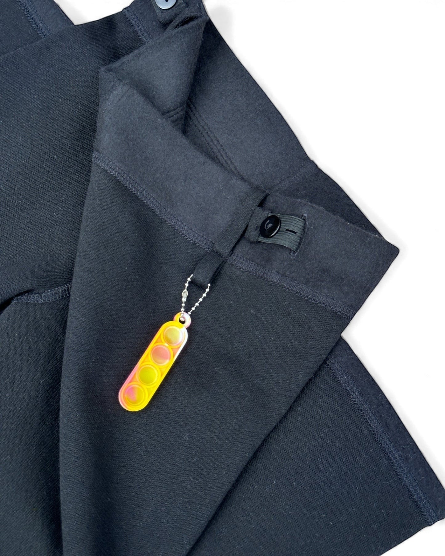 Sensitive Little Souls black fleece-lined joggers with adjustable waist and fidget loop for kids with sensory needs.
