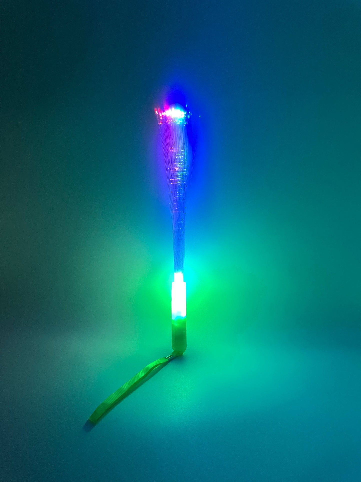 Sensitive Little Souls LED Flash Fibre Rod with green lanyard, illuminates with blue and pink light for sensory play.