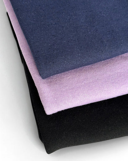 Sensitive Little Souls lilac, navy, and black fleece-lined adaptive leggings with adjustable waist and fidget loop.
