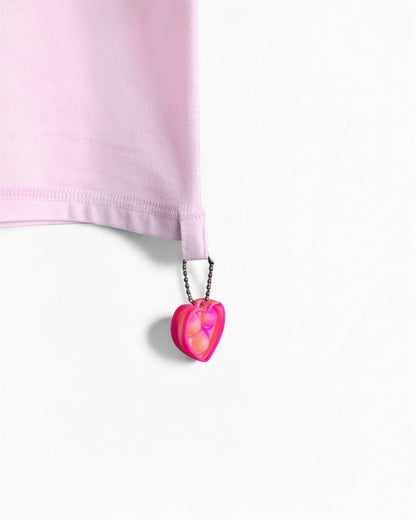 Sensitive Little Souls pink adaptive t-shirt with flat seams, tagless design, and a heart-shaped fidget loop.