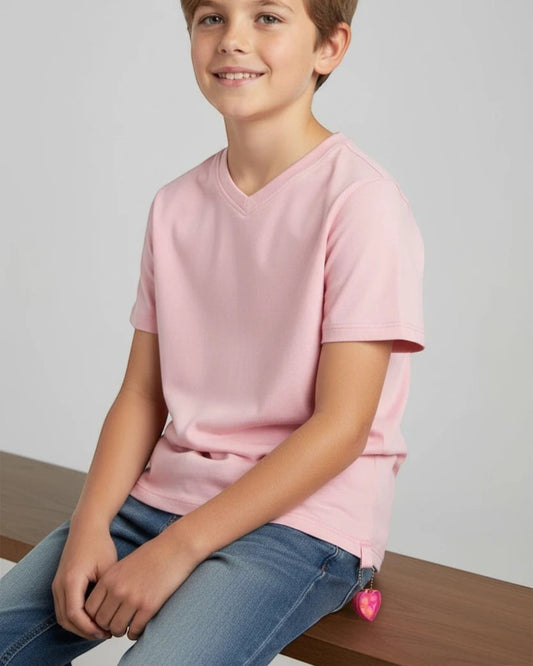 Sensitive Little Souls pink adaptive t-shirt with flat seams and a heart-shaped fidget toy attached to the hem.
