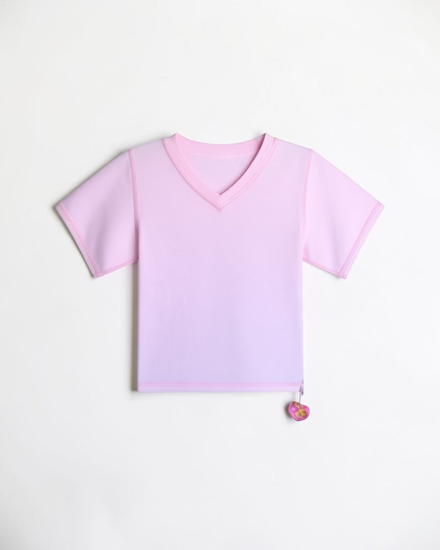 Sensitive Little Souls pink short sleeve V-neck t-shirt with fidget loop, flat seams, and tagless design for sensory comfort.