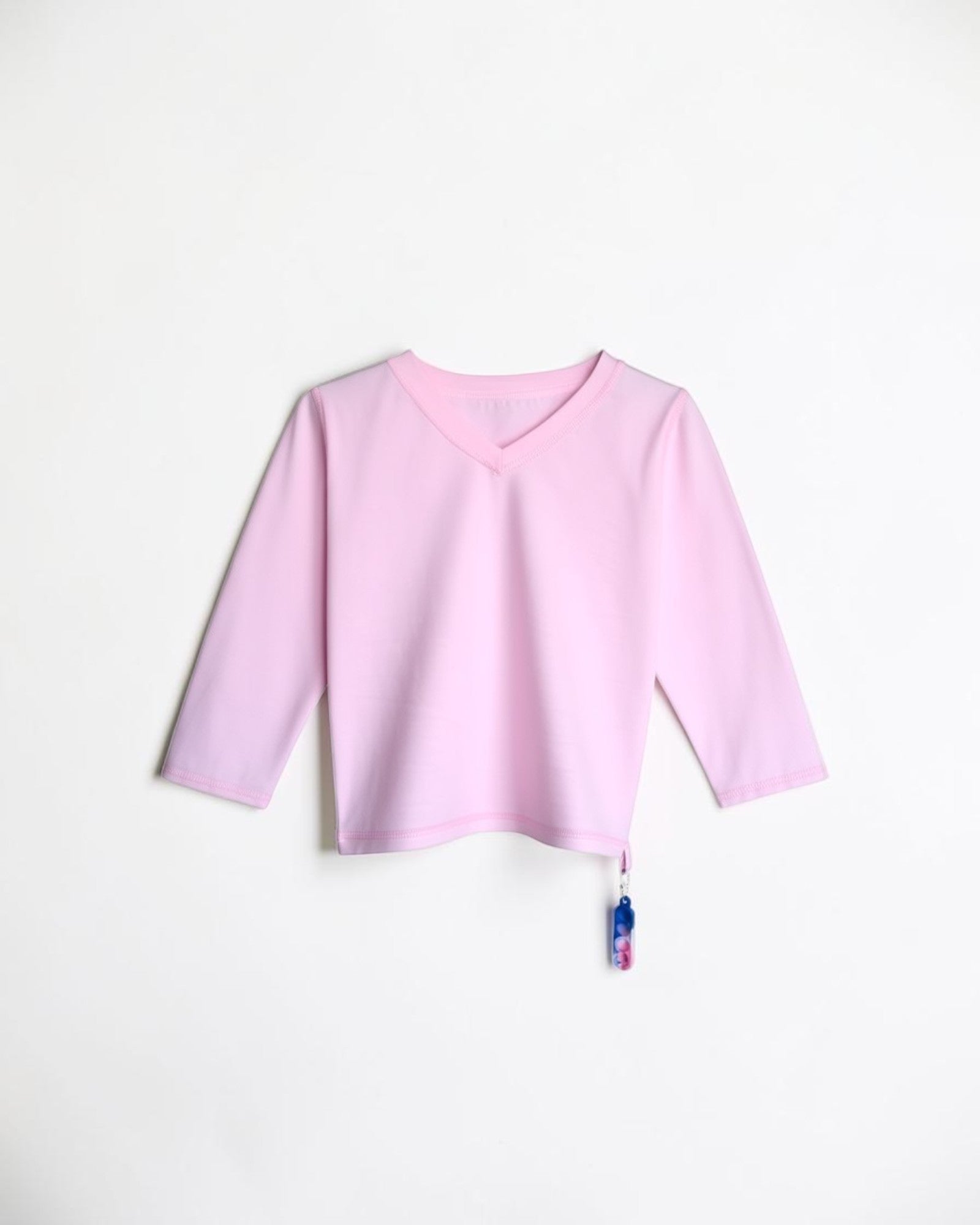 Sensitive Little Souls pink long sleeve t-shirt with V-neck and fidget loop, made from cotton-polyester blend.