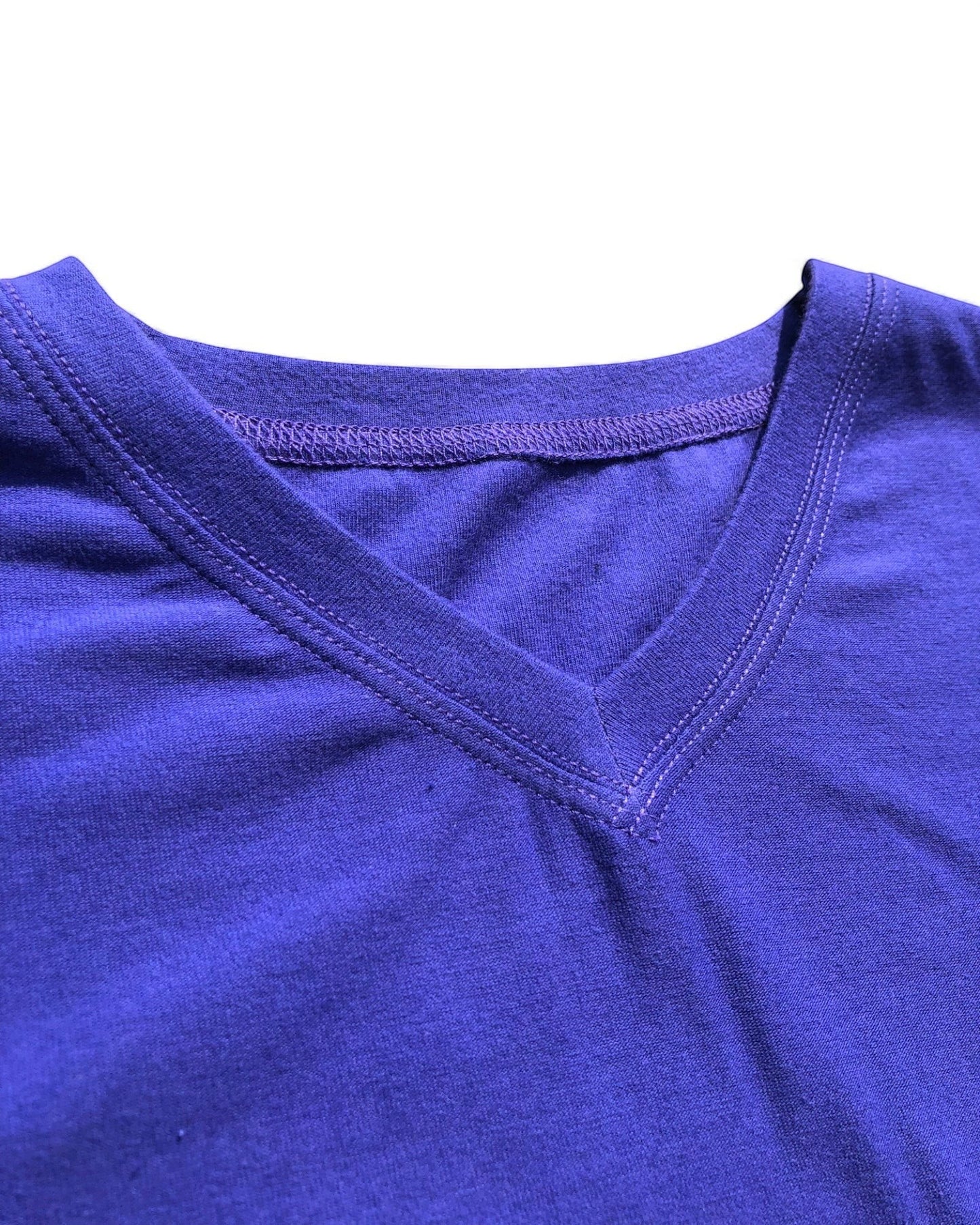 Sensitive Little Souls purple short sleeve t-shirt with V-neck, flat seams, and tagless design for sensory comfort.