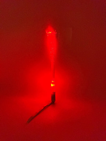 Sensitive Little Souls red LED flash fibre rod toy for sensory play, creating a mesmerizing light display.