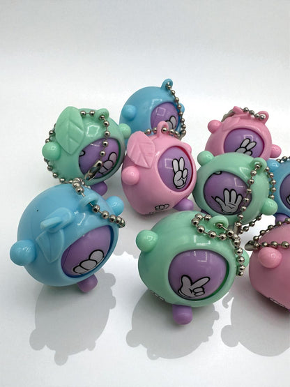 Sensitive Little Souls pastel Rock-Paper-Scissors game sensory toy with keychain. Features hand gestures in pink, blue, and green.