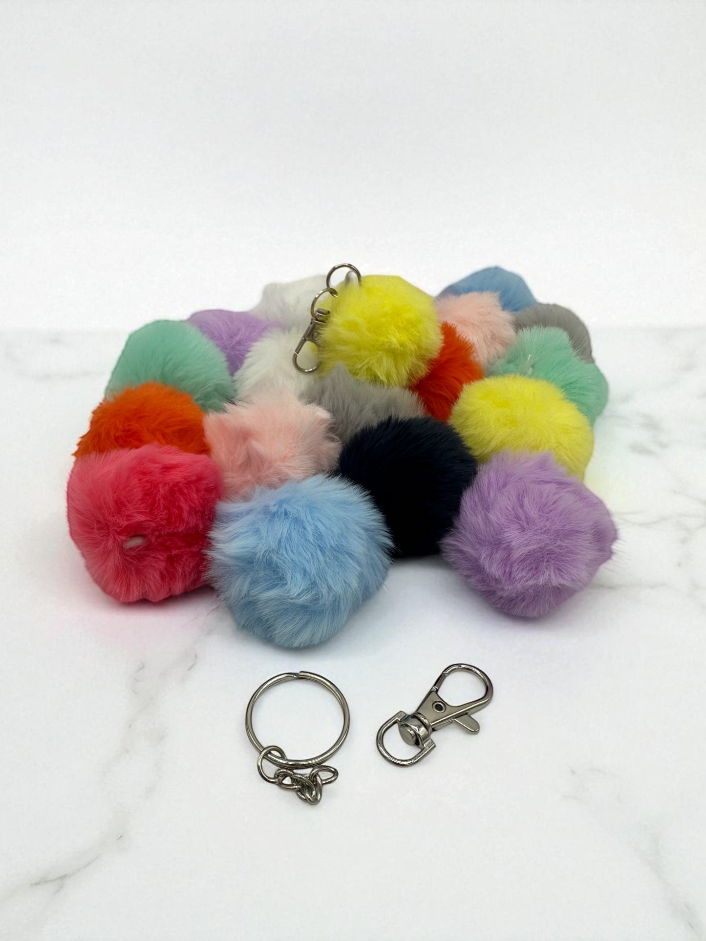 Sensitive Little Souls assorted color sensory plush balls with keychain attachments.