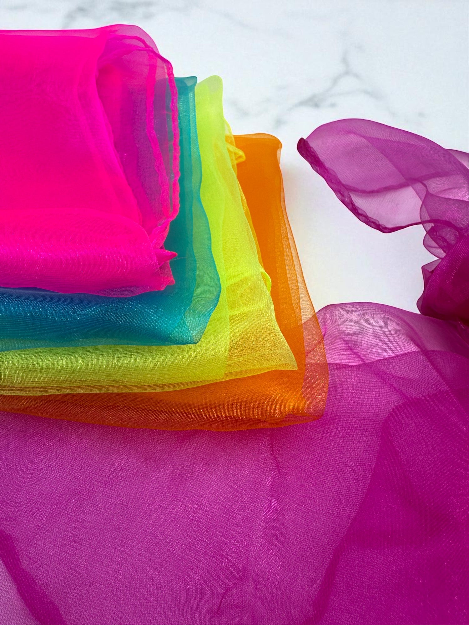 Sensitive Little Souls vibrant sensory scarf in sheer organza with neon pink, teal, lime green, orange, and magenta gradient.