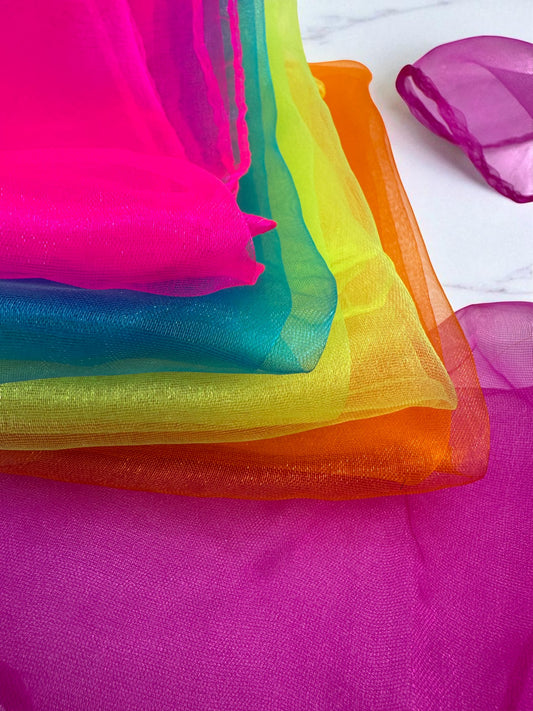 Sensitive Little Souls vibrant organza sensory scarf with neon pink, teal, yellow, orange, and purple gradient colors.