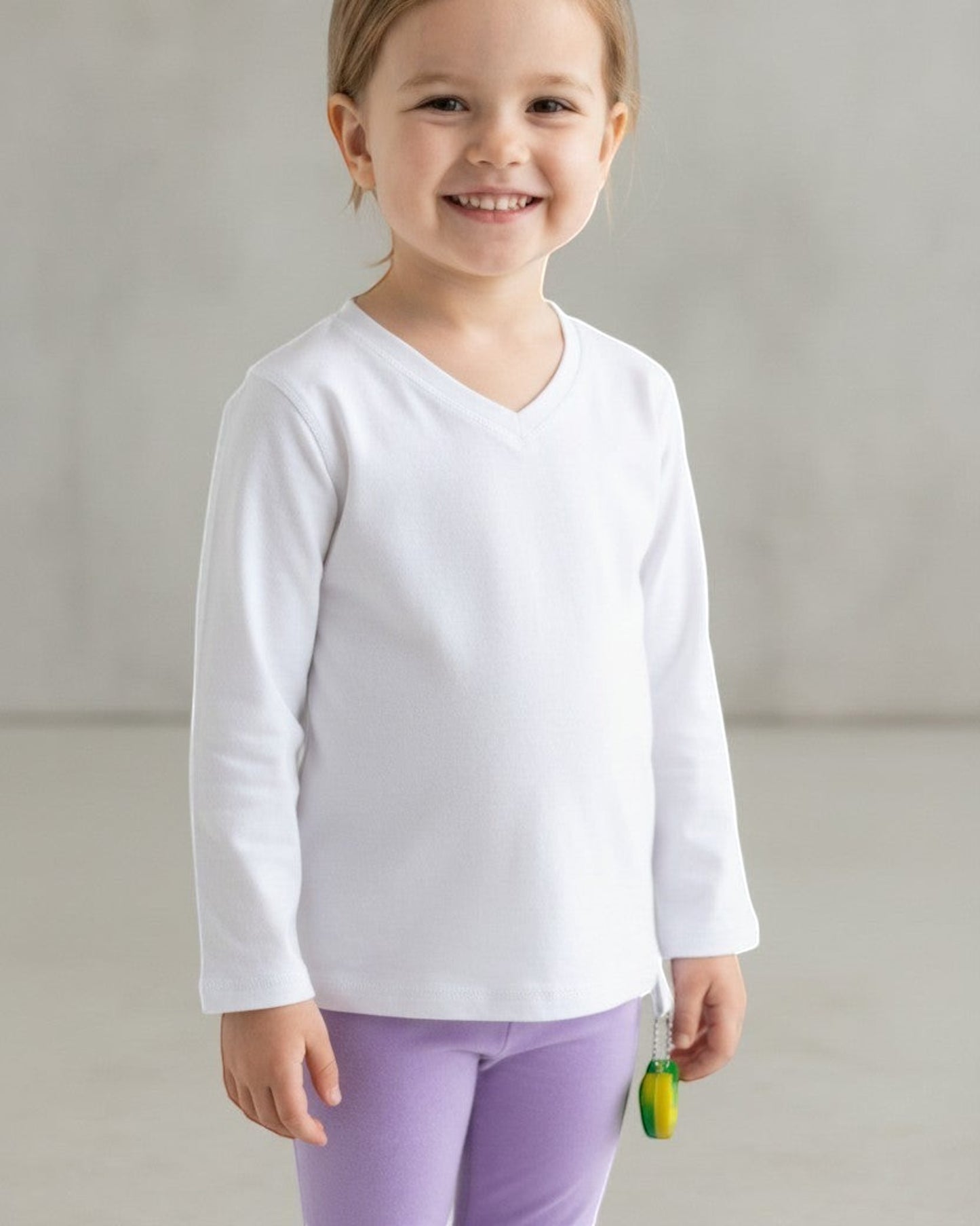 Sensitive Little Souls white long-sleeve adaptive t-shirt with V-neck and fidget loop, made from cotton-polyester blend.