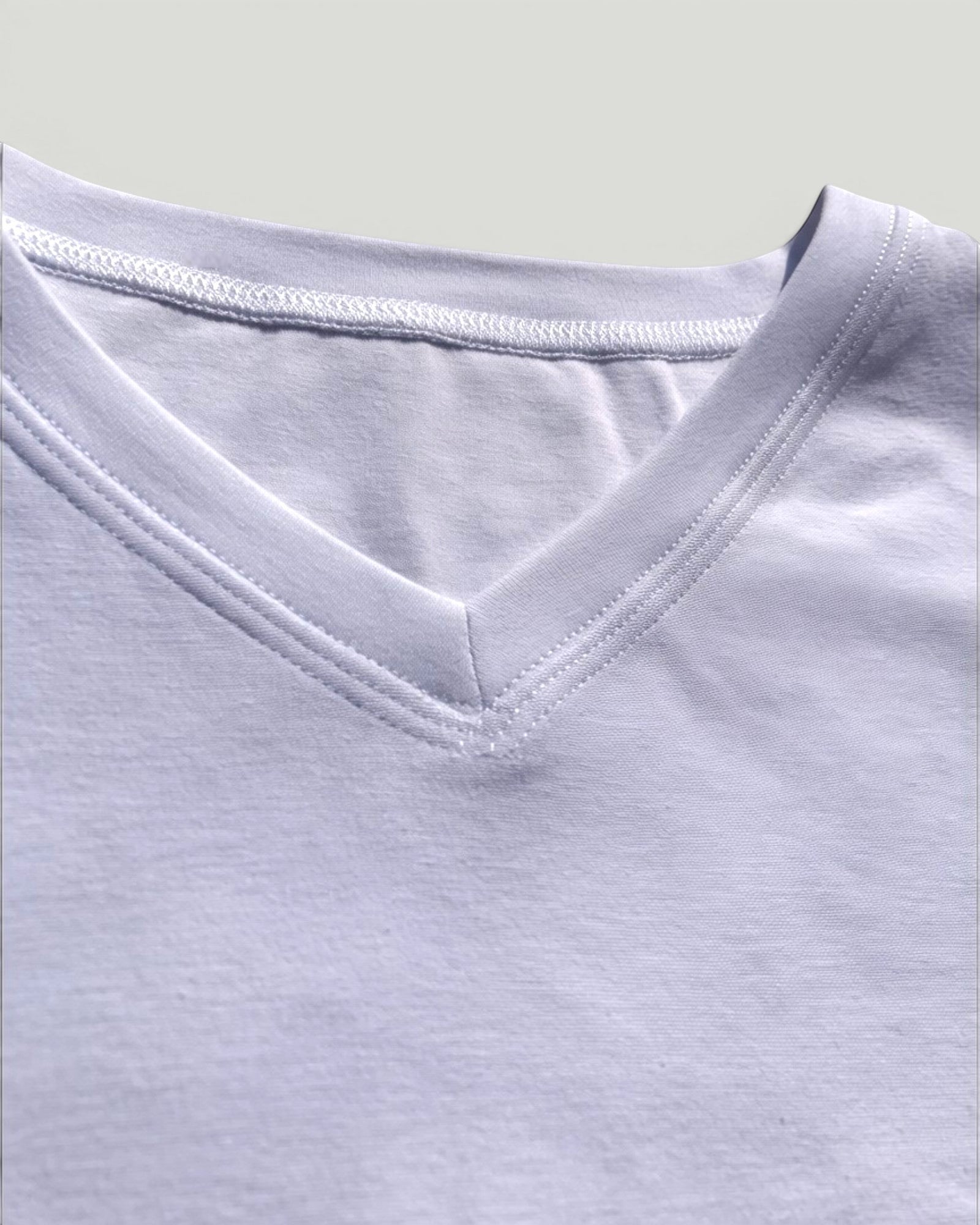 Sensitive Little Souls white cotton blend V-neck t-shirt with flat seams and tagless design.