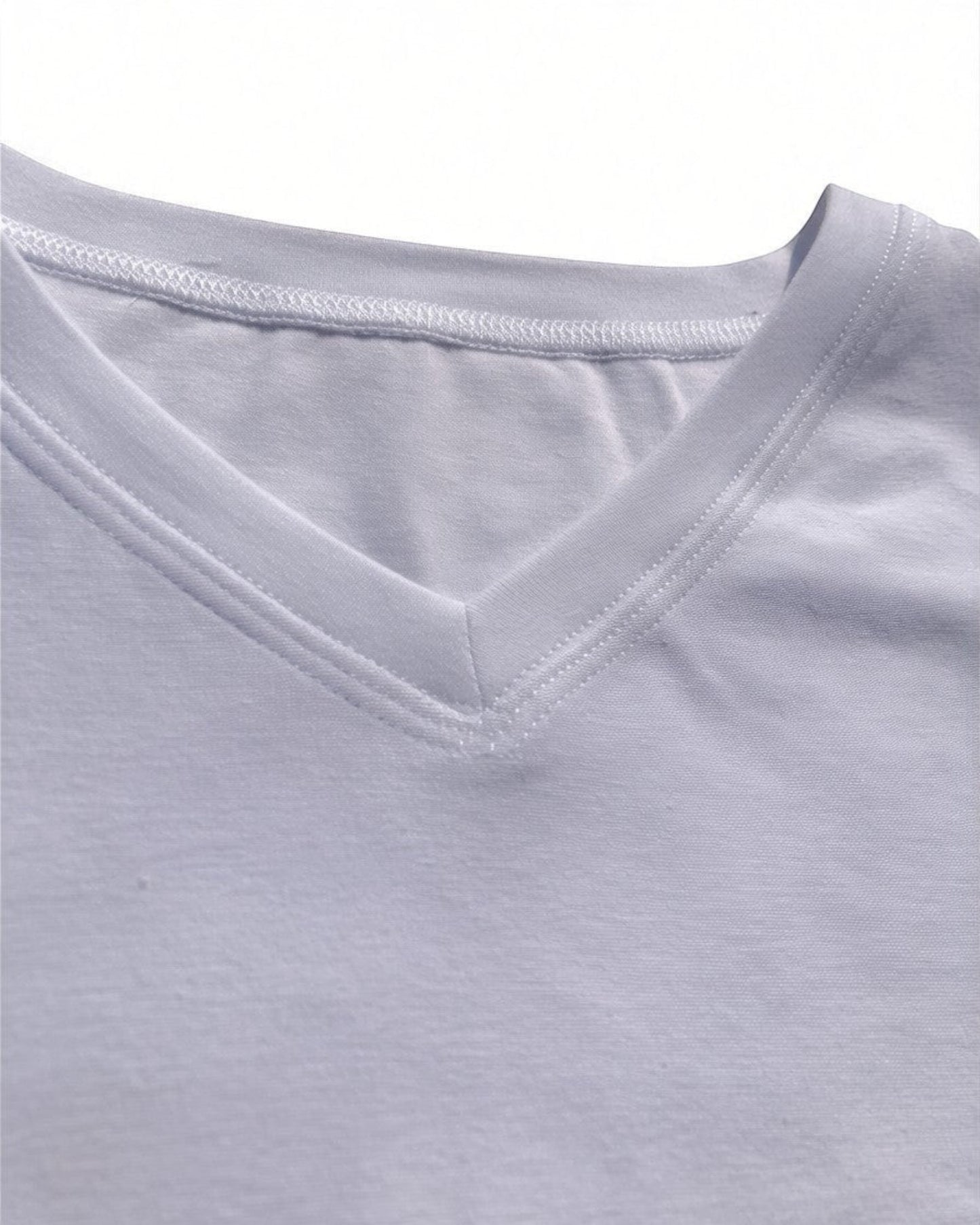 Sensitive Little Souls white short sleeve t-shirt with V-neck, flat seams, and tagless design for sensory comfort.