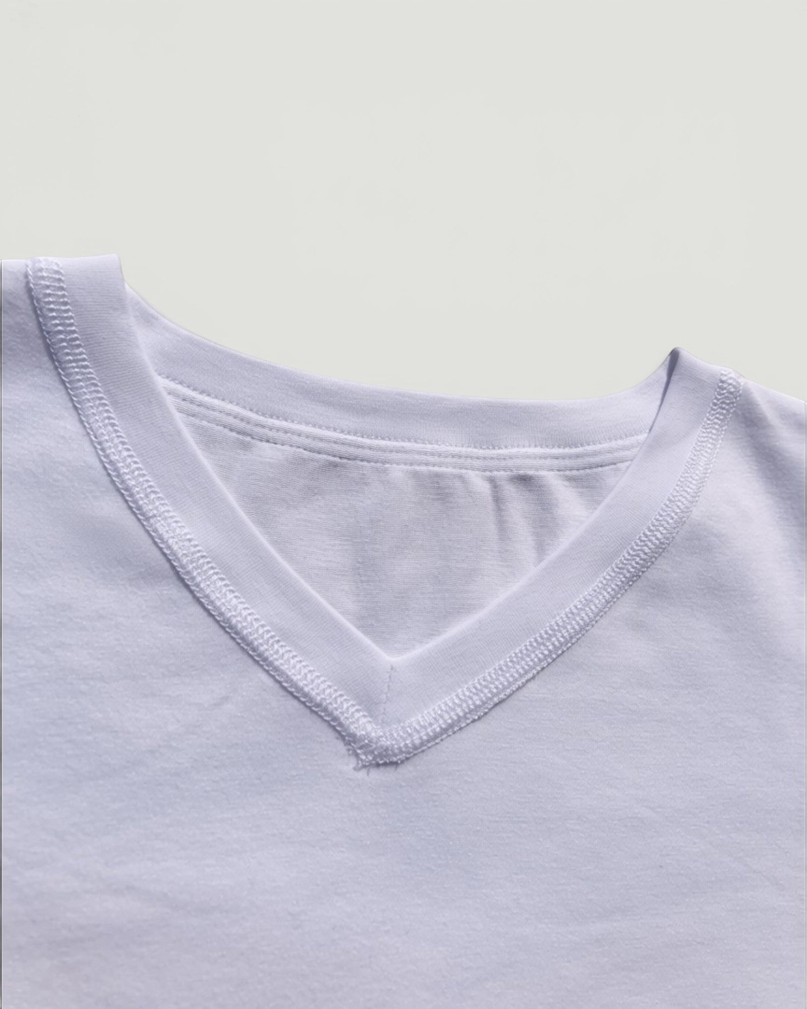 Sensitive Little Souls white adaptive long sleeve t-shirt with V-neck and flat seams, designed for comfort.