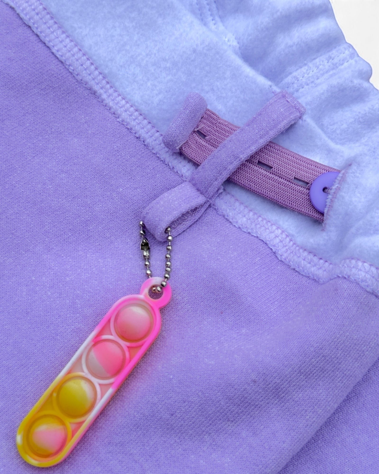 Sensitive Little Souls lilac fleece-lined adaptive leggings with adjustable waist and fidget loop.